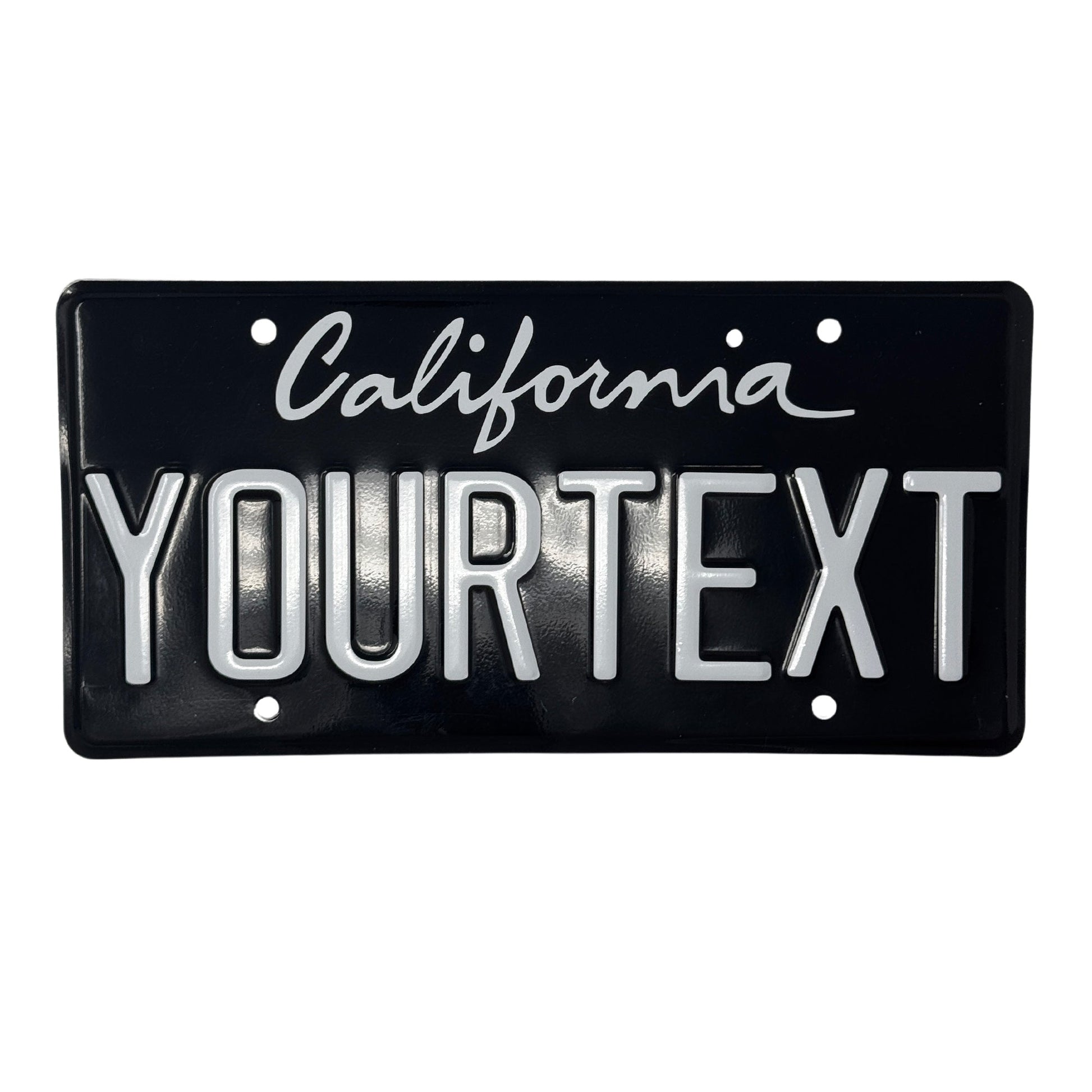 California license plate. The top one is a black and white license plate with a cursive "California" writing. The license plate spells out "YOURTEXT". 